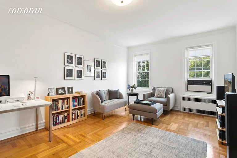 New York City Real Estate | View 140 8th Avenue, 6R | Living room windows overlook a leafy side street. | View 2