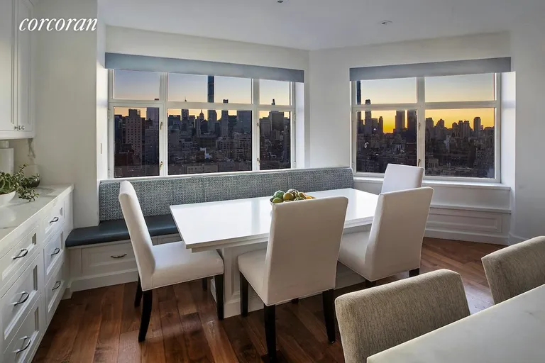 New York City Real Estate | View 188 East 76th Street, 28FL | Eat in Kitchen at Sunset | View 23