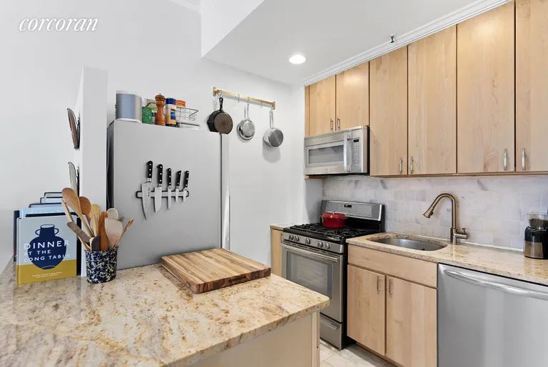 New York City Real Estate | View 24 8th Avenue, 4A | Tall cabinets, full-sized appliances & granite! | View 3