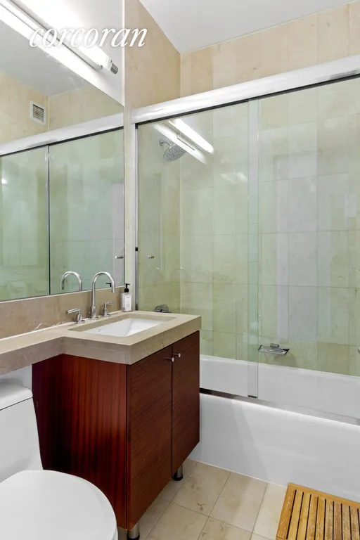 New York City Real Estate | View 30 West Street, PH2D | Marble Bathroom | View 4