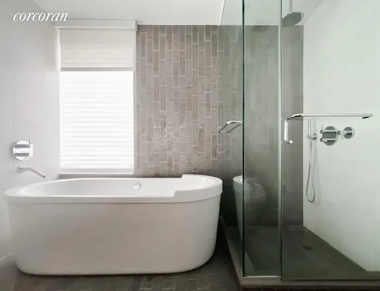 New York City Real Estate | View 447 West 18th Street, 3E | Master Bathroom with Philip Stark Tub | View 6
