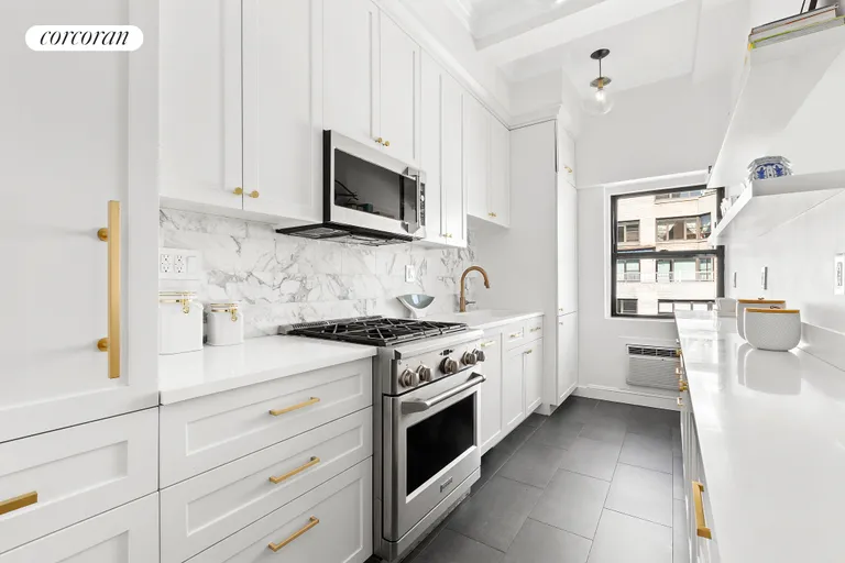 New York City Real Estate | View 1349 Lexington Avenue, 9C | Beautifully renovated custom white galley kitchen  | View 4