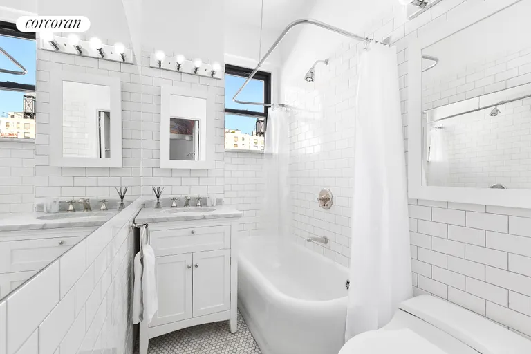New York City Real Estate | View 1349 Lexington Avenue, 9C | Updated white tiled bathroom with tub | View 13