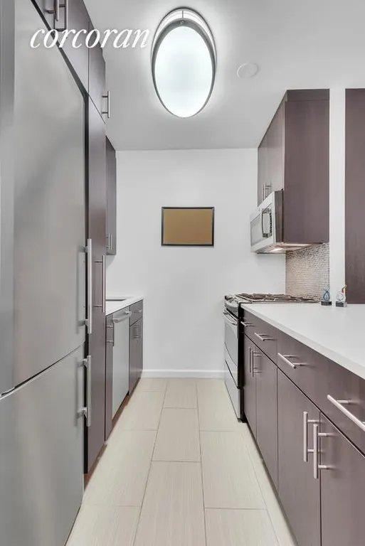 New York City Real Estate | View 45 East 25th Street, 25C | Sleek, modern, renovated kitchen! | View 5