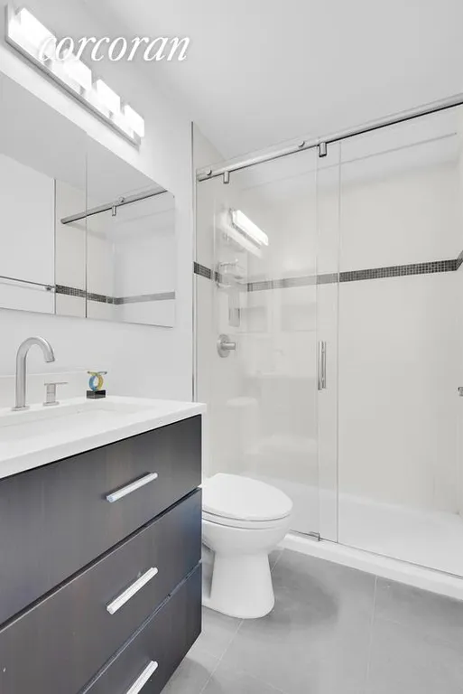 New York City Real Estate | View 45 East 25th Street, 25C | Renovated master bath with walk-in shower! | View 7