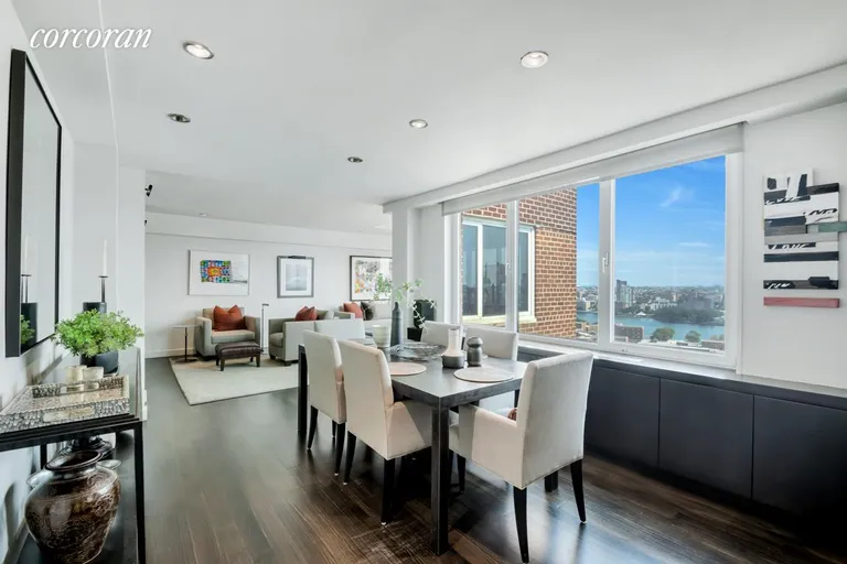 New York City Real Estate | View 1 Gracie Terrace, 20B | Dining Room Into Living Room | View 4
