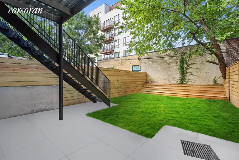New York City Real Estate | View 407 Quincy Street | Lush yard with new wooden fence and planters! | View 15