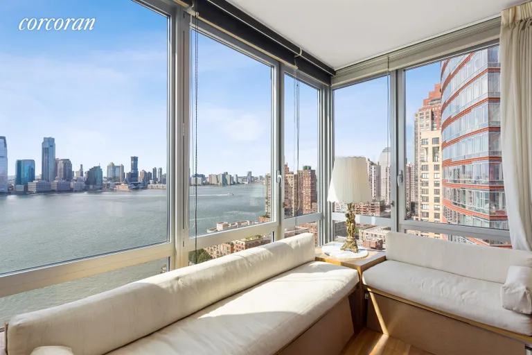 New York City Real Estate | View 30 West Street, 24A | Living Room with River Views | View 3