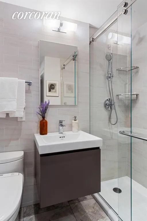 New York City Real Estate | View 10 Plaza Street East, 8G | Modern, renovated bathroom | View 5