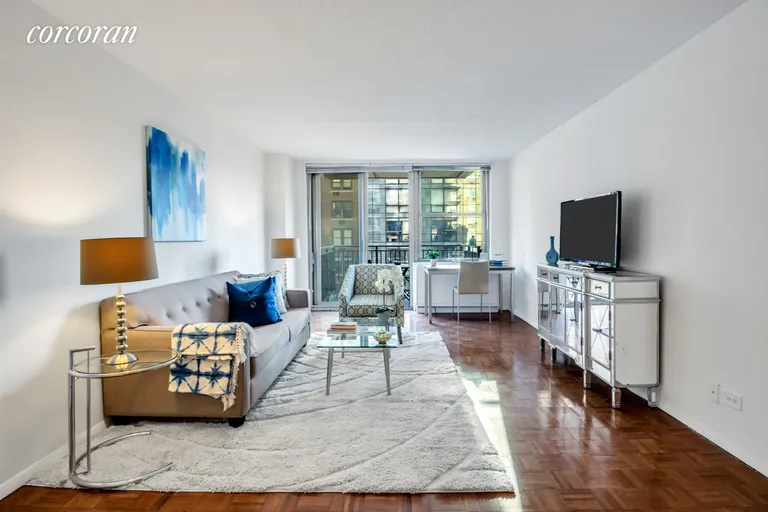 New York City Real Estate | View 301 East 79th Street, 11S | Spacious Living Room/  Southern Exposure   | View 2