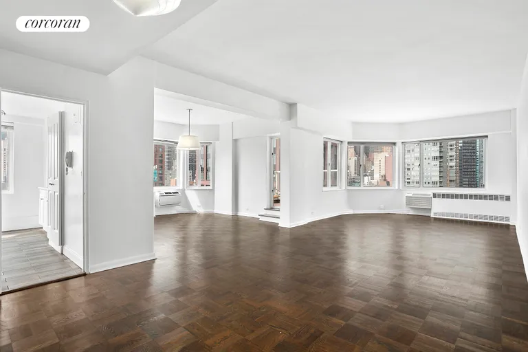 New York City Real Estate | View 411 East 53rd Street, 20C | Living room, dining area & entrance to the kitchen | View 8
