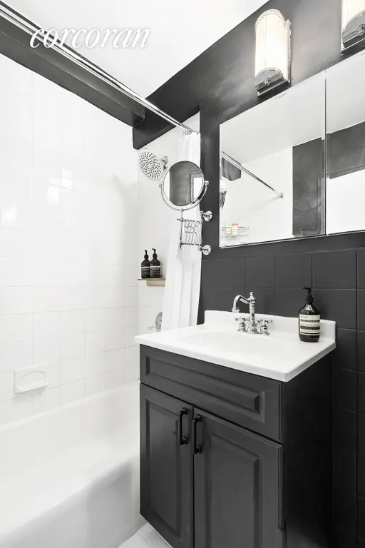 New York City Real Estate | View 31 Jane Street, 6G | modern bathroom with tub and rainshower | View 6