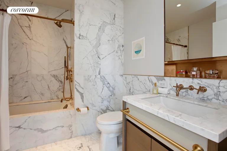 New York City Real Estate | View 305 East 51st Street, 16D | Well-appointed marble bathroom | View 5