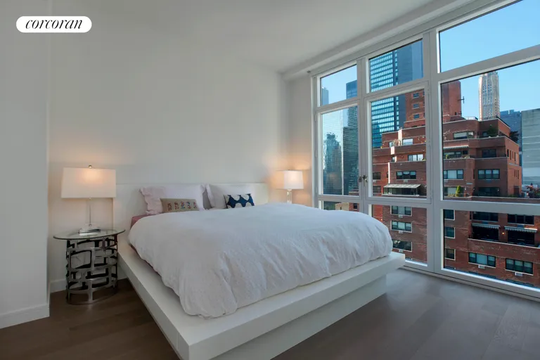 New York City Real Estate | View 305 East 51st Street, 16D | Sun-splashed bedroom with 2 closets & open views | View 4