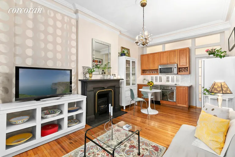 New York City Real Estate | View 111 West 11th Street, 1FW | Kitchen and Fireplace | View 2