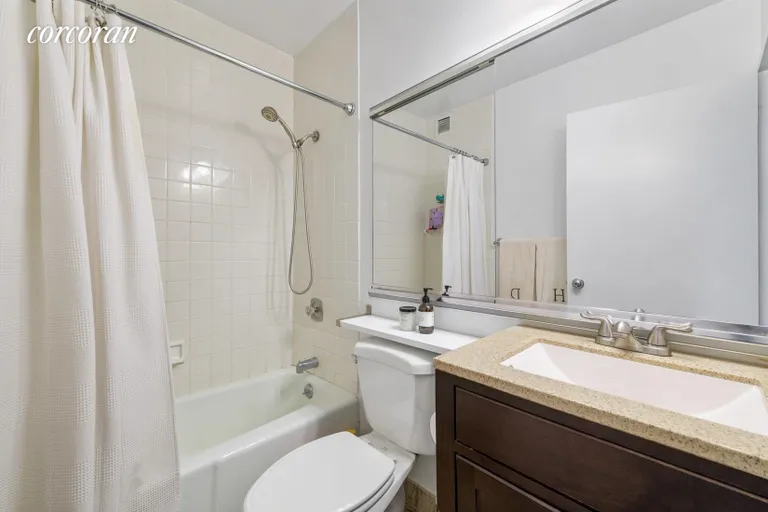 New York City Real Estate | View 347 West 57th Street, 15B | Bathroom with wood vanity  | View 4