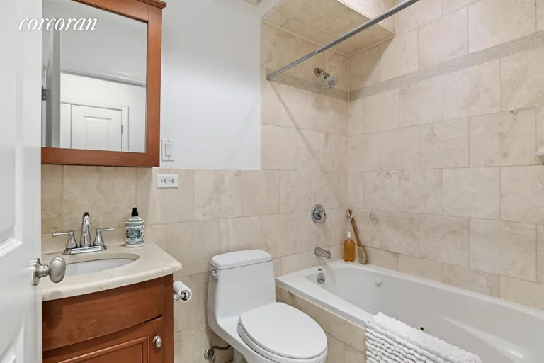 New York City Real Estate | View 41 Park Place, 1 | Full bath with tub and storage | View 8