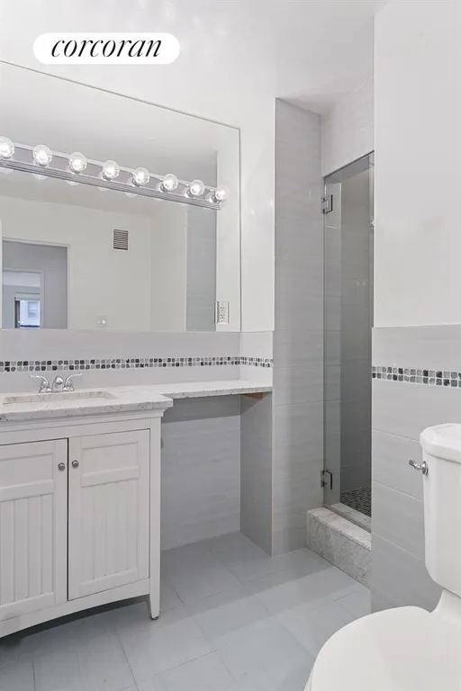 New York City Real Estate | View 225 East 57th Street, 9F | Hall Bathroom | View 6