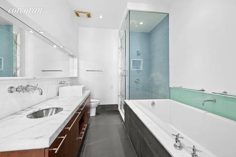 New York City Real Estate | View 60 Broadway, 10F | Primary en-suite bathroom with oversized tub  | View 8