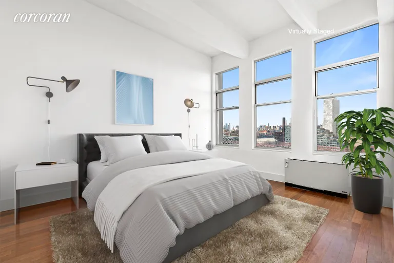 New York City Real Estate | View 60 Broadway, 10F | Primary Bedroom with oversized windows and VIEWS! | View 5