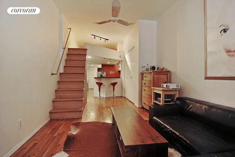 New York City Real Estate | View 23 Waverly Place, 5J | Stairs lead up to sleep/storage space | View 2