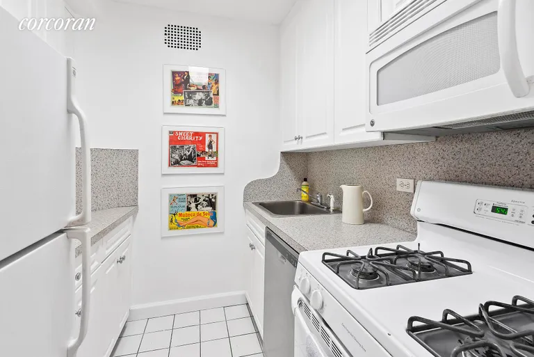 New York City Real Estate | View 34 Plaza Street East, 701 | The galley kitchen has full-sized appliances. | View 5