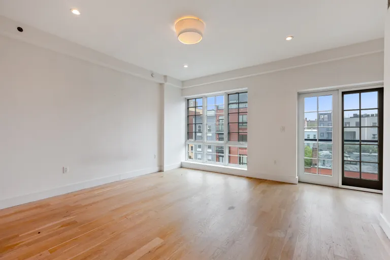 New York City Real Estate | View 821 DeKalb Avenue, 3 | King-sized primary bedroom w/ balcony | View 3