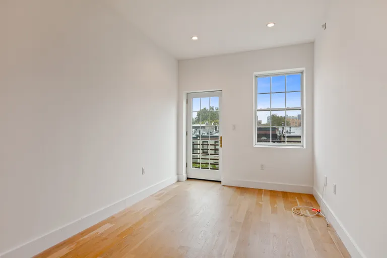 New York City Real Estate | View 821 DeKalb Avenue, 3 | Second bedroom w/ balcony | View 5