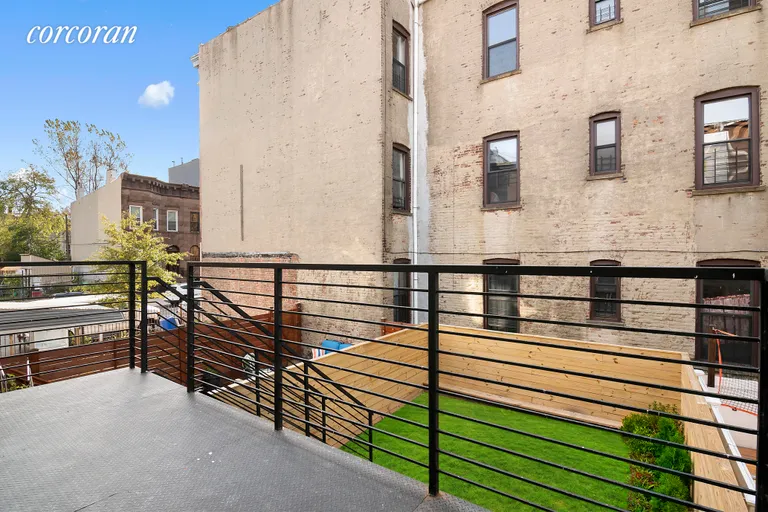 New York City Real Estate | View 134A Patchen Avenue | Metal terrace overlooking lush garden! | View 4
