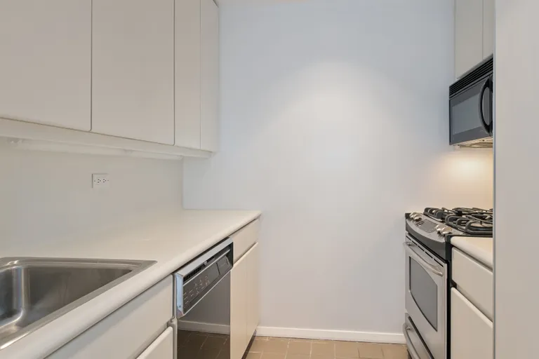 New York City Real Estate | View 100 United Nations Plaza, 32E | Galley kitchen with dishwasher | View 2