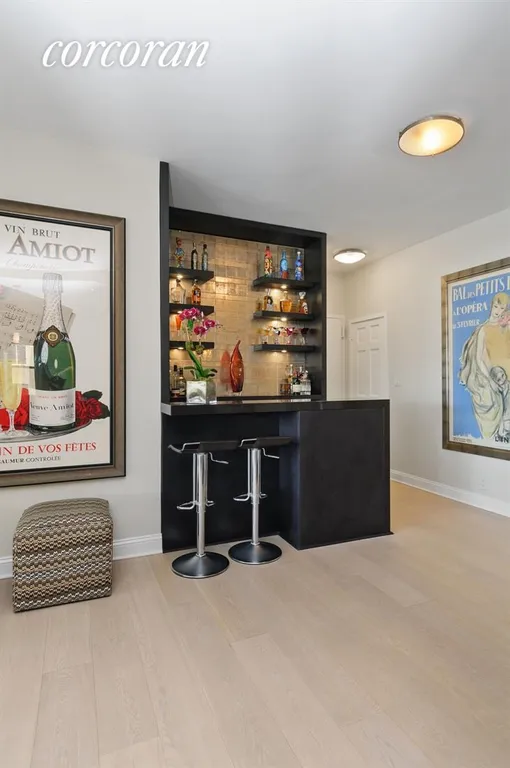 New York City Real Estate | View 340 East 64th Street, 9G | Enrty foyer and bar | View 8