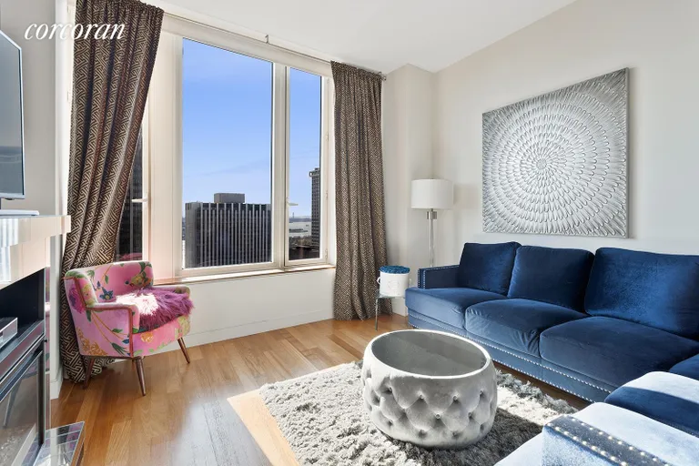 New York City Real Estate | View 15 William Street, 46C | Furnished living room  | View 2