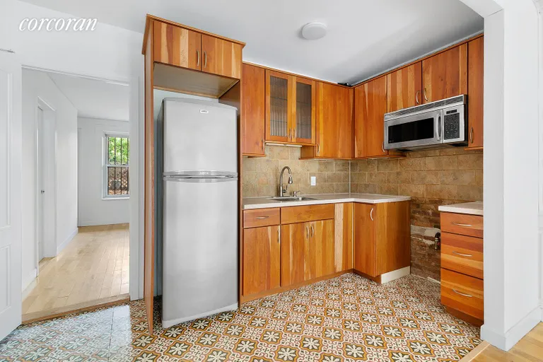 New York City Real Estate | View 223 Greene Avenue | Garden Apartment Kitchen and Bedroom | View 12