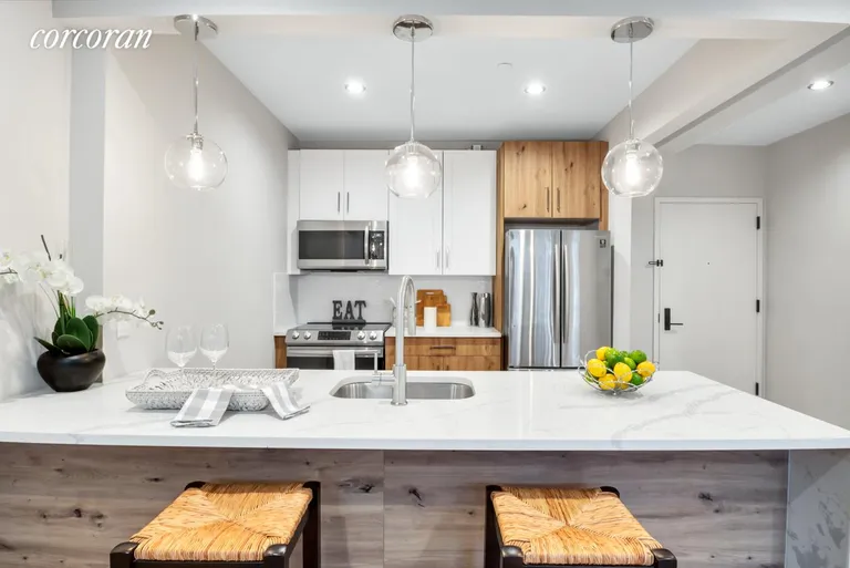 New York City Real Estate | View 340-342 Chauncey Street, 342C | Two-Tone White Shaker Cabinetry w. Quartz Island | View 5