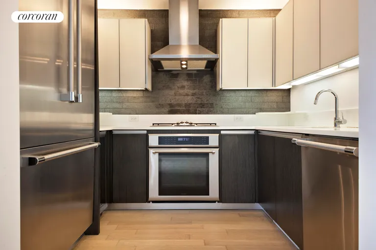 New York City Real Estate | View 247 West 46th Street, 2305 | Sleek modern kitchen | View 3