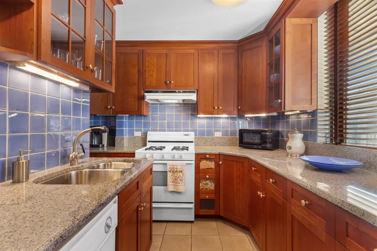 New York City Real Estate | View 115 East 87th Street, 19F | Windowed Granite & Tiled Kitchen w/Pantry | View 7