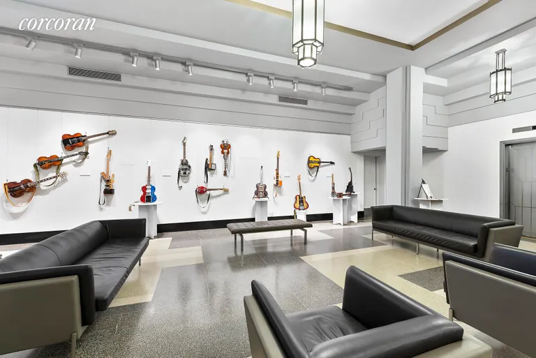 New York City Real Estate | View 310 Riverside Drive, 314 | Art deco lobby with current exhibit | View 6
