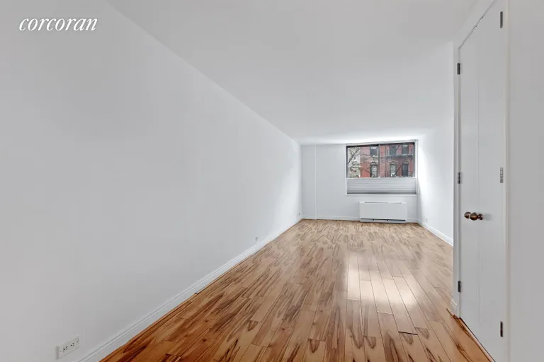 New York City Real Estate | View 393 West 49th Street, 2Q | Living Room | View 7