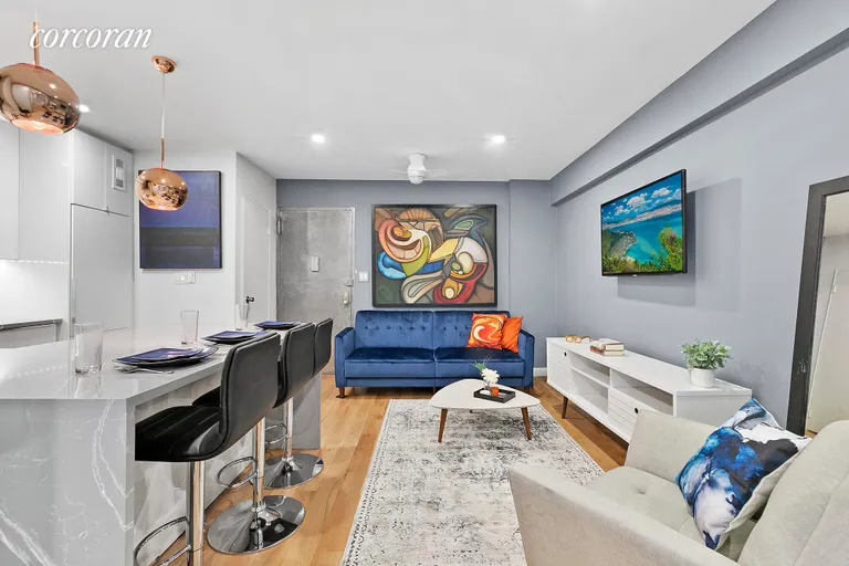 New York City Real Estate | View 170 West 23rd Street, 3R | Living Room Open to Kitchen | View 2