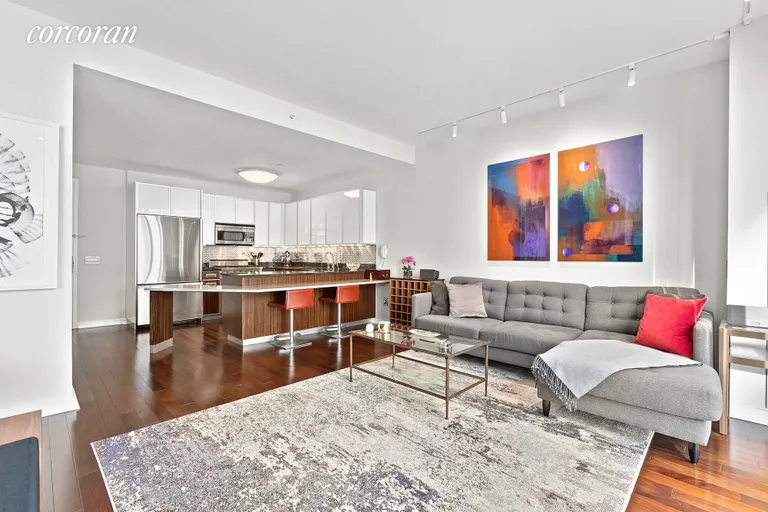 New York City Real Estate | View 130 West 19th Street, 8B | Living Room and Kitchen | View 4