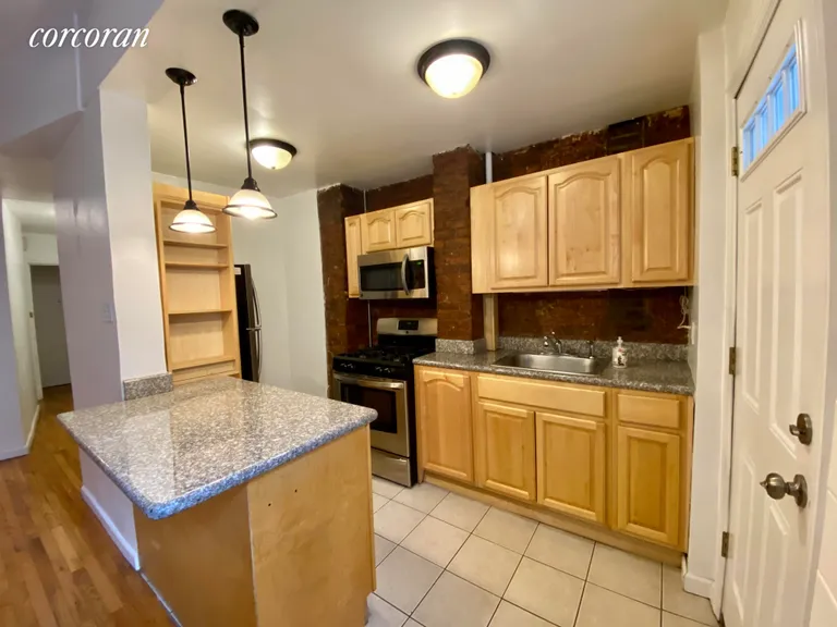 New York City Real Estate | View 449 Henry Street, 1 | Island in the Kitchen; exposed Bricks | View 5