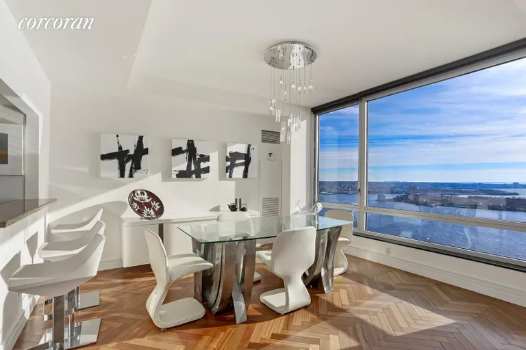 New York City Real Estate | View 10 West Street, 37G | Dining Room w/ Direct River Views | View 7