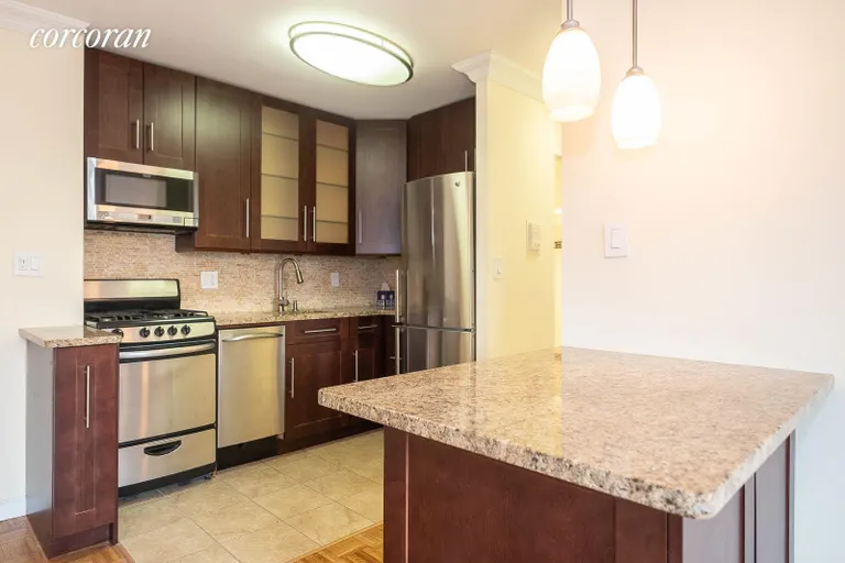 New York City Real Estate | View 353 East 72Nd Street, 24B | The island and the kitchen | View 8