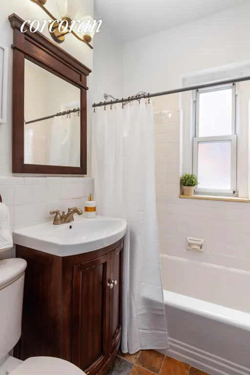 New York City Real Estate | View 25 Plaza Street West, 1L | Windowed Bathroom | View 12