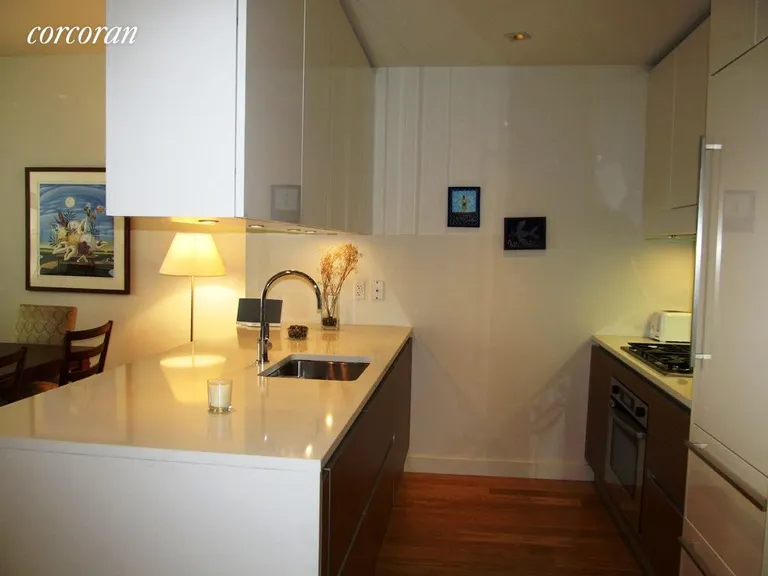 New York City Real Estate | View 555 West 59th Street, 9C | Open kitchen w/stone counters and custom cabinetry | View 2