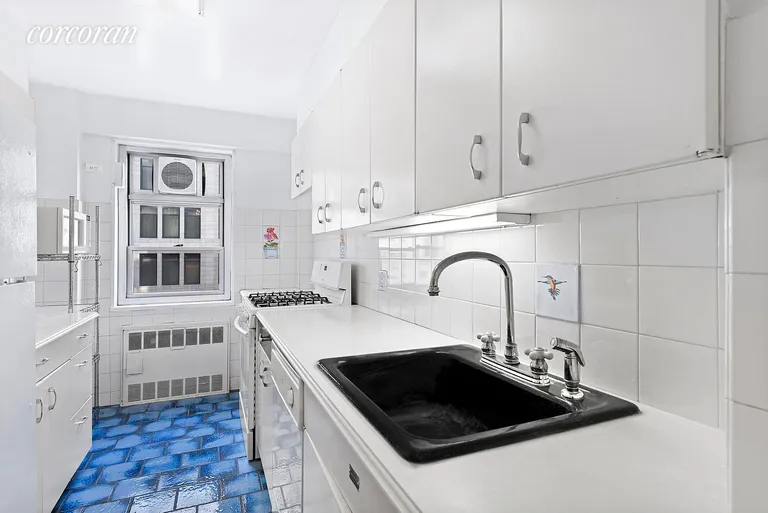 New York City Real Estate | View 70 East 10th Street, 14K | Windowed Kitchen - can be opened to | View 5