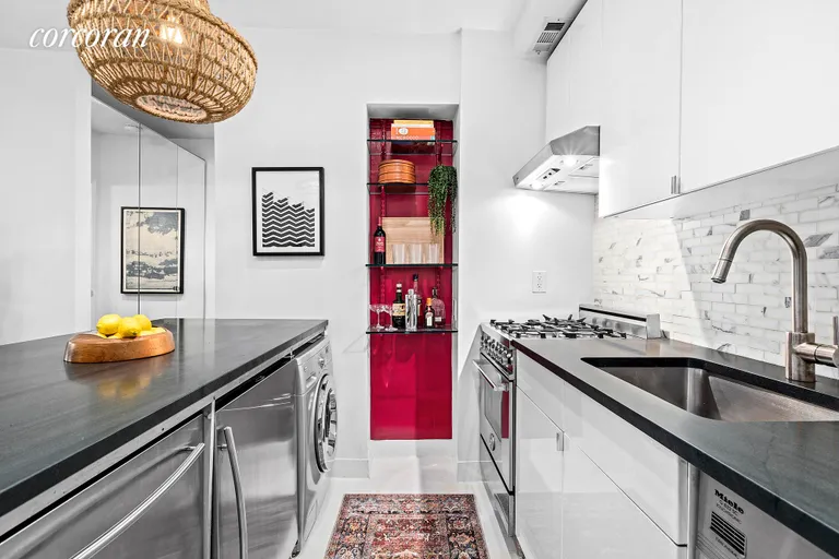 New York City Real Estate | View 460 West 23rd Street, GF | Open Kitchen with compact Stainless | View 4