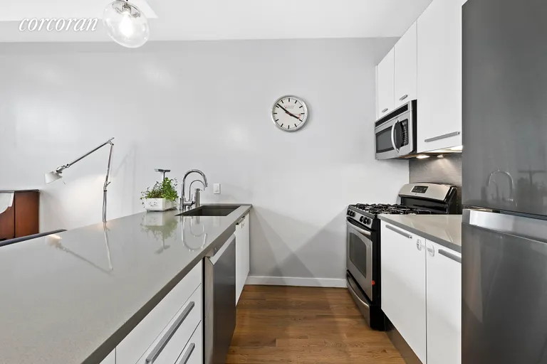 New York City Real Estate | View 122 West Street, 5P | Open kitchen with stainless appliances | View 3