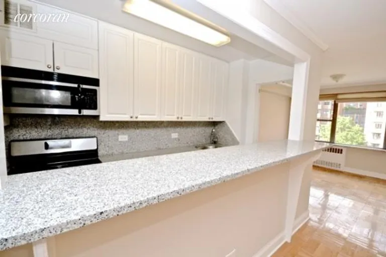 New York City Real Estate | View 420 East 55th Street, 10E | Kitchen with Breakfast Bar | View 5