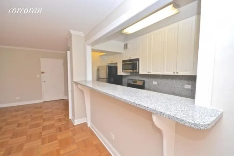 New York City Real Estate | View 420 East 55th Street, 10E | Kitchen with Breakfast Bar | View 6